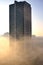 Helbor commercial building enveloped by fog at dawn in the city