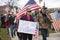 Helena, Montana - April 19, 2020: Woman protesting holding say no to tyranny sign at a rally over the Coronavirus government
