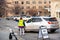 Helena, Montana / November 3, 2020: Woman election official directing voter where to park and vote, man in vehicle holding ballot