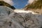 Heli hiking on the glacier floor high up in the Southern alps mountain peaks on Fox