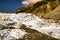 Heli hiking on the glacier floor high up in the Southern alps mountain peaks on Fox Glacier