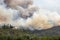 Helicopter against wildfire during strong wind and drought near Miren Castle in Slovenia