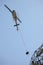 Helicopter Airlifting Workmen from Power Line