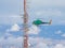 Helicopter approaching a communications antenna