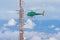 Helicopter approaching a communications antenna
