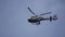 Helicopter in the cloudy sky with lightning. Helicopter From Below Flying Through Cloudy Sky. Helicopter hovering