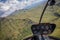 Helicopter cockpit view flying over mountains