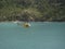 Helicopter flies over the artificial lake of `Place moulin` in Val D`Aosta