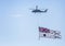 Helicopter flying with large Australian flag beneath