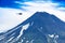 Helicopter flying over Ilyinsky Volcano and Kurile lake