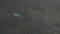 Helicopter flying over mountains at heavy rain