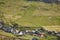 Helicopter flying over mykines village in Faroe. Denmark