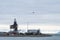 Helicopter flying over the port in Longyearbyen, Svalbard