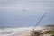 Helicopter Flying Over a Stranded Sailboat on a Florida Beach