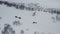 A helicopter landed in the Arctic to pick up a group of researchers. Aerial view of the rescue operation of a group of