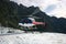 Helicopter landing on ice on mountain top