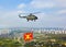 Helicopter with military flag over Moscow at parade of victory d