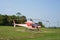 Helicopter parked at the helipad near forest