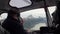 Helicopter pilots flies to helipad in snowy mountains in New Zealand.