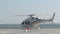 Helicopter prepares to take off on large asphalt runway