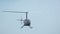 Helicopter Robinson R-44 is flying in slow motion.