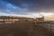 Heligoland - harbor with pier and colorful houses at sunrise with dramatic beautiful sky