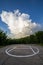 Helipad in the field in cloudy day