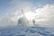 Heliski helicopter takes off in snow powder freeride landed on mountain