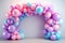 Helium balloons arch on pastel background. Wall decorated with colorful balloons for birthday party, baby shower, wedding. Mockup