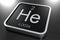 Helium element from periodic table on black square block