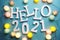 Hello 2021 alphabet letter with cotton ball LED decoration on blue background