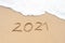 Hello 2021 sign on the sandy beach. Welcoming 2021 with new resolutions, dreams concept