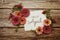 Hello April typography text with flowers on wooden background