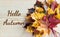 Hello Autumn writing with maple leaf autumn bouquet