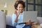 Hello. Cheerful teen schoolgirl using laptop, waving hello while chatting with friends or teacher during online lesson