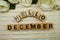 Hello December alphabet letters on colorful stripes background