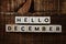 Hello December alphabet letters with space copy on wooden background