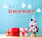 Hello December message with a Christmas tree and gift boxes