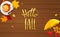 Hello Fall lettering on wooden background.