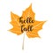 Hello Fall - welcoming autumn season greeting card design. Bright yellow artistic maple leaf with watercolor texture