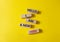 Hello I am a new hire symbol. Concept words Hello I am a new hire on wooden blocks. Beautiful yellow background. Business and