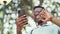 Hello, phone or video call for black man in a park, talking or speaking in communication with a happy smile. Blurry