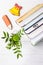 Hello, September. Books, bookmark glasses, gingerbread pencil and yellow bell, green chrysanthemum on a white background