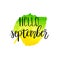 Hello september hand lettering phrase on yellow and green watercolor leaf background.