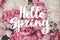 Hello Spring lettering on peonies wallpaper. Hello spring text on  stylish pink and white peony bouquet.  Floral greeting card or