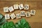 Hello Summer alphabet letter on wooden background