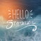 Hello Summer Typography on Sunshine Blurred Dark Blue Beach Back