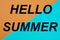 HELLO SUMMER word written on a beautiful sheet of paper is yellow blue