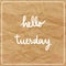 Hello Tuesday on brown crumpled paper background