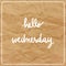 Hello Wednesday on brown crumpled paper background